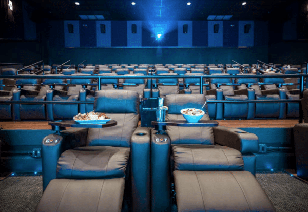 Recliners in movie theater with food served