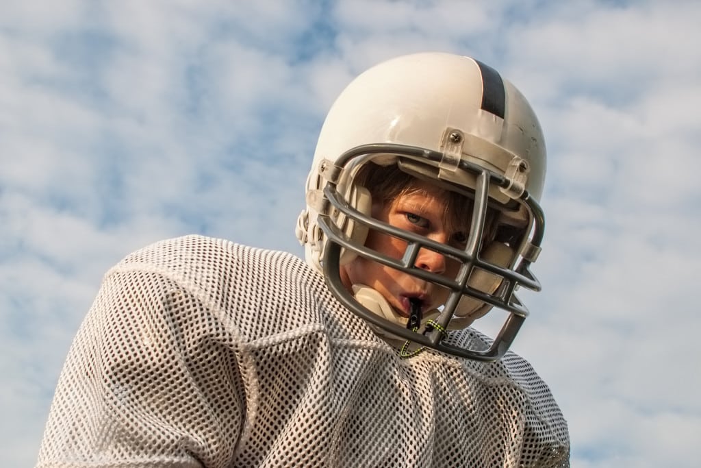 Football player with mouthguard 