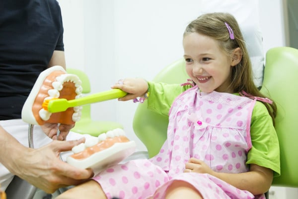 Young girl in dental chair
