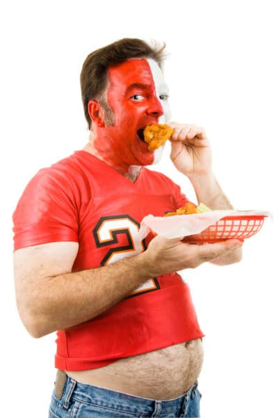 sports fan eating fried food