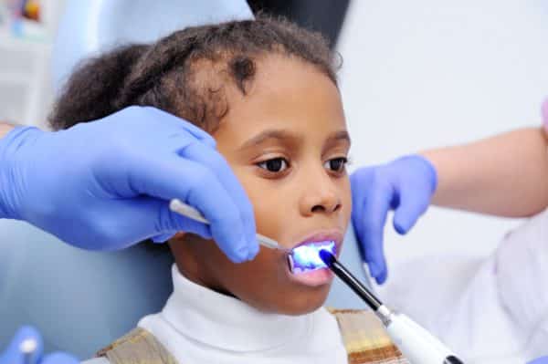 Little girl getting dental filling